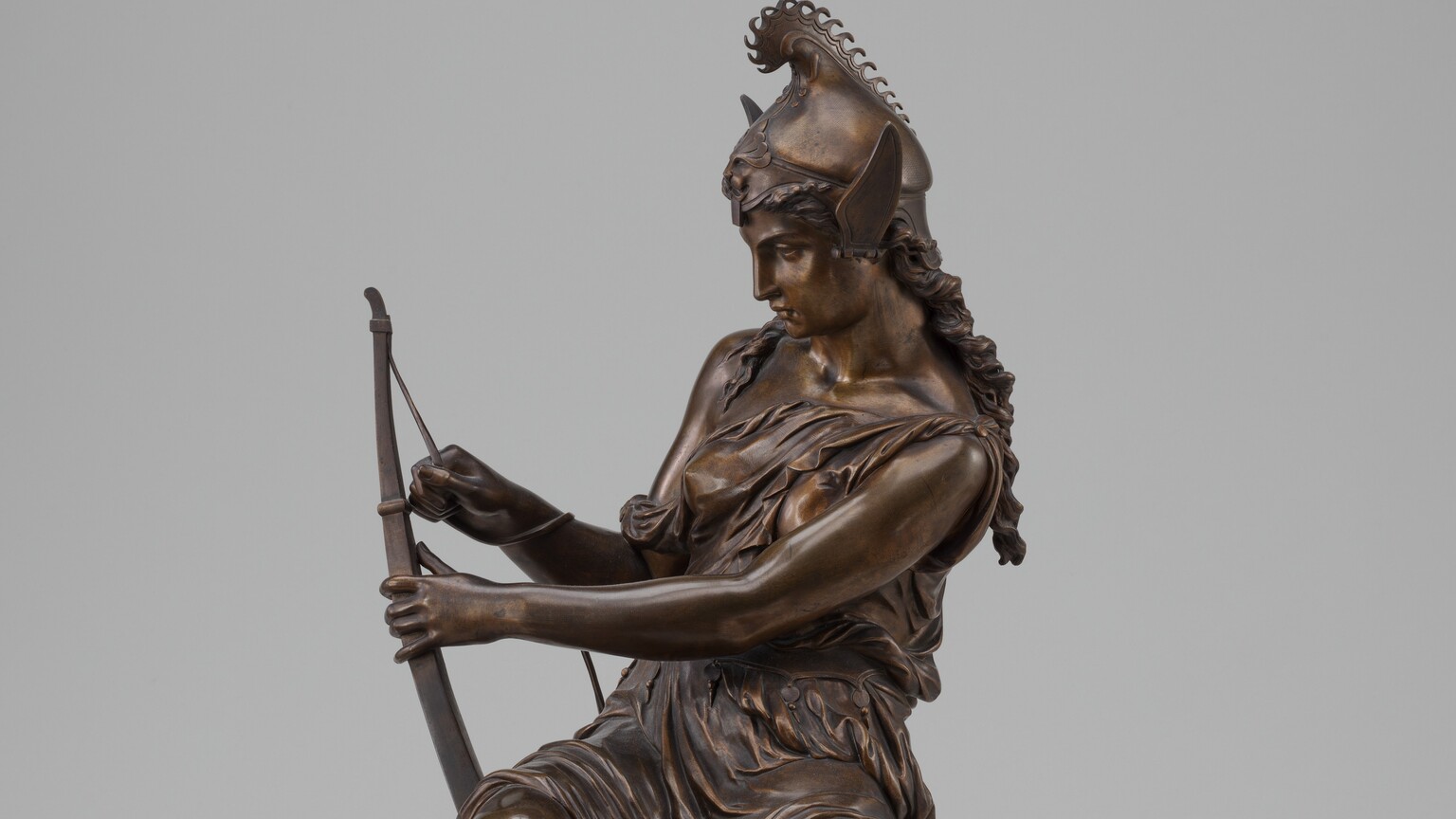 A woman holding a bow and arrow.