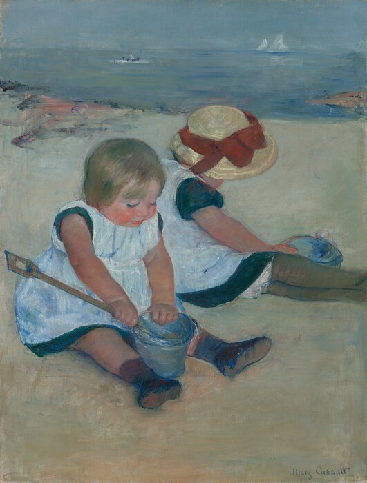 Two pale-skinned little girls sit back-to-back on a sandy beach, almost filling the width of this vertical painting. The girls wear matching pale, ice-blue pinafores over short sleeve, ocean-blue dresses. Both sit with their legs stretched in front of them and angled to our right. The girl closest to us, to our left, looks down at the denim-blue pail and wooden shovel she holds between her ankles. She holds the long-handled shovel in her near hand with the end inside the pail. She has a chubby, flushed, round face with blond hair and rosy arms and legs. She wears black shoes and appears to have a brown sock on her near leg but a dark blue sock on the other. Her companion sits just beyond her and to our right with her body turned away from us. Her wide-brimmed straw hat is trimmed with a tomato-red ribbon tied in a bow at the front. The hat hides her face, and her outstretched legs are encased in olive-green stockings. Her near hand reaches across her lap to grab the pail sitting on the far side of her legs. The beach meets the pale blue and aquamarine ocean in the upper third of the painting. A patch of strokes and daubs of dark blue and peach near the upper left and a tan wedge in the water to our right are painted loosely along the shoreline. Two white sailboats and a horizontal white dash with three dark blue dots drift on the water. The artist signed the lower right, “Mary Cassatt.”