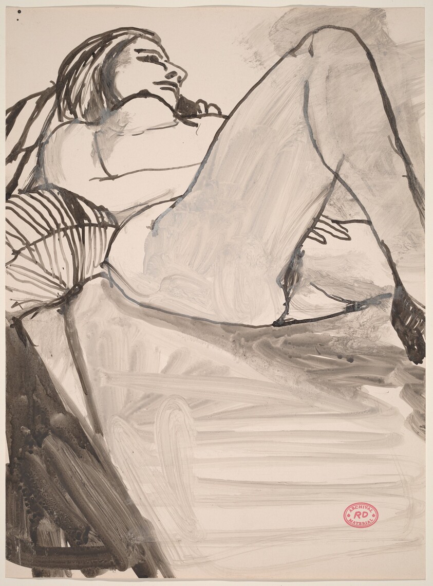 Untitled [female nude reclining on striped pillows]