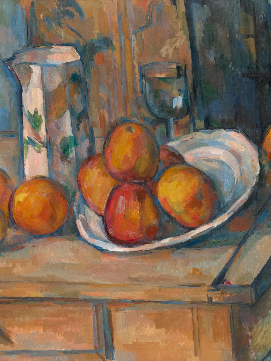 We look down onto nine pieces of fruit, a pitcher, a goblet, and a dish arranged on a rustic wood table in front of a floral curtain in this nearly square, loosely painted still life. The table extends off the left edge of the composition and the back, right corner of the table just touches the right edge of the canvas. At the center of the composition, five pieces of marigold-orange fruit with yellow highlights and scarlet-red shading are piled in the dish. The side of the dish to our right is slightly tipped up so the fruit settles near the rim to our left. The dish is painted with loose strokes of sky blue, shell pink, pale yellow, and parchment white. Three more pieces of fruit, including a lemon, sit to our left of the dish and one more piece of fruit sits near the back corner of the table, behind the dish, to our right. Immediately behind the dish is a stemmed glass with a tall, rounded bowl. To our left, between the fruit on the table and in the platter, is a tall, angular, tapering pitcher. The pitcher is painted with emerald and moss-green leaves against a background painted with strokes of light peach, blush pink, slate blue, and one wide stroke of amber orange. The wooden table is peanut brown streaked with strokes of apricot orange and pale sage green. One drawer at the front has a round, wooden pull. There seem to be at least two panels of curtains hanging behind the table. Down the center of the background is a panel of coral peach and saffron orange with a floral pattern painted in wheat brown and denim blue. To our right, the panel is streaked with vertical strokes of teal, midnight, and navy blue. The area to our left, behind the table, could be the panel of a door, painted with pale turquoise. The fruit, dish, vessels, table, curtain, and door are all outlined with cobalt blue.