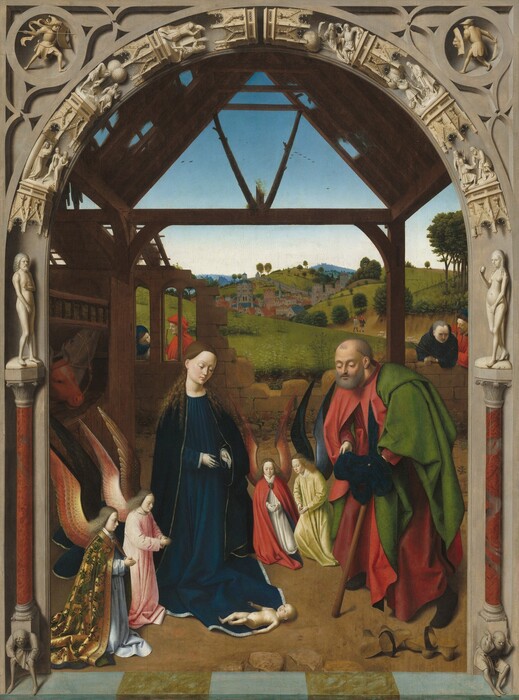 A man, woman, and four winged angels gather and kneel around a nude infant lying on the ground under a stone arched opening set in front of a landscape in this vertical painting. All of the people have pale white or lightly tanned skin. To our left, the woman wears gold-edged, royal-blue robes and has long, curly brown hair. The baby lies on the hem of her robe, his body facing her. An older, balding and bearded man kneels to the right, leaning on a walking stick. He wears a red garment under a green robe, and he holds a hat in his hands as he gazes at the baby. About a third the size of the man and woman, two of the angels kneel between the man and woman and another pair kneel to our left of the woman, seeming close to us. The angels wear colorful gold, pink, red, or yellow robes and all have long wavy blond hair. Their hands touch in prayer and all look down toward the baby. The people are sheltered in front of a crumbling stone wall under a wooden structure. To our left, a cow and donkey are penned in a stable. Two pairs of men stand near or lean on the other side of the rock wall that encloses the scene. A landscape with green rolling hills and a distant town with towers and buildings fills the background beneath a clear blue sky. A triangular structure made of wood beams is framed within the carved archway, which seems to separate us from the space of the painting. The face of the arch looks like it is carved with a nude man atop a column to the left and a similar woman to the right, and with miniature scenes stacked on tiny platforms curving upward to the apex of the arch.