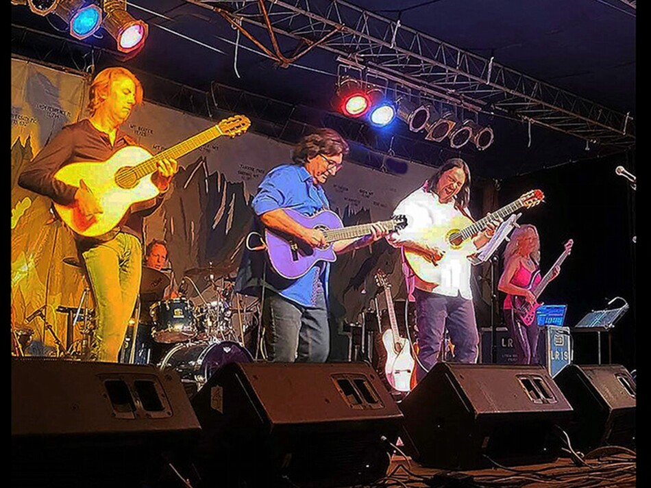 A band playing live on a stage.