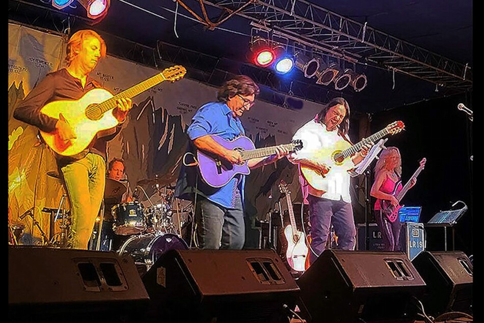 A band playing live on a stage.