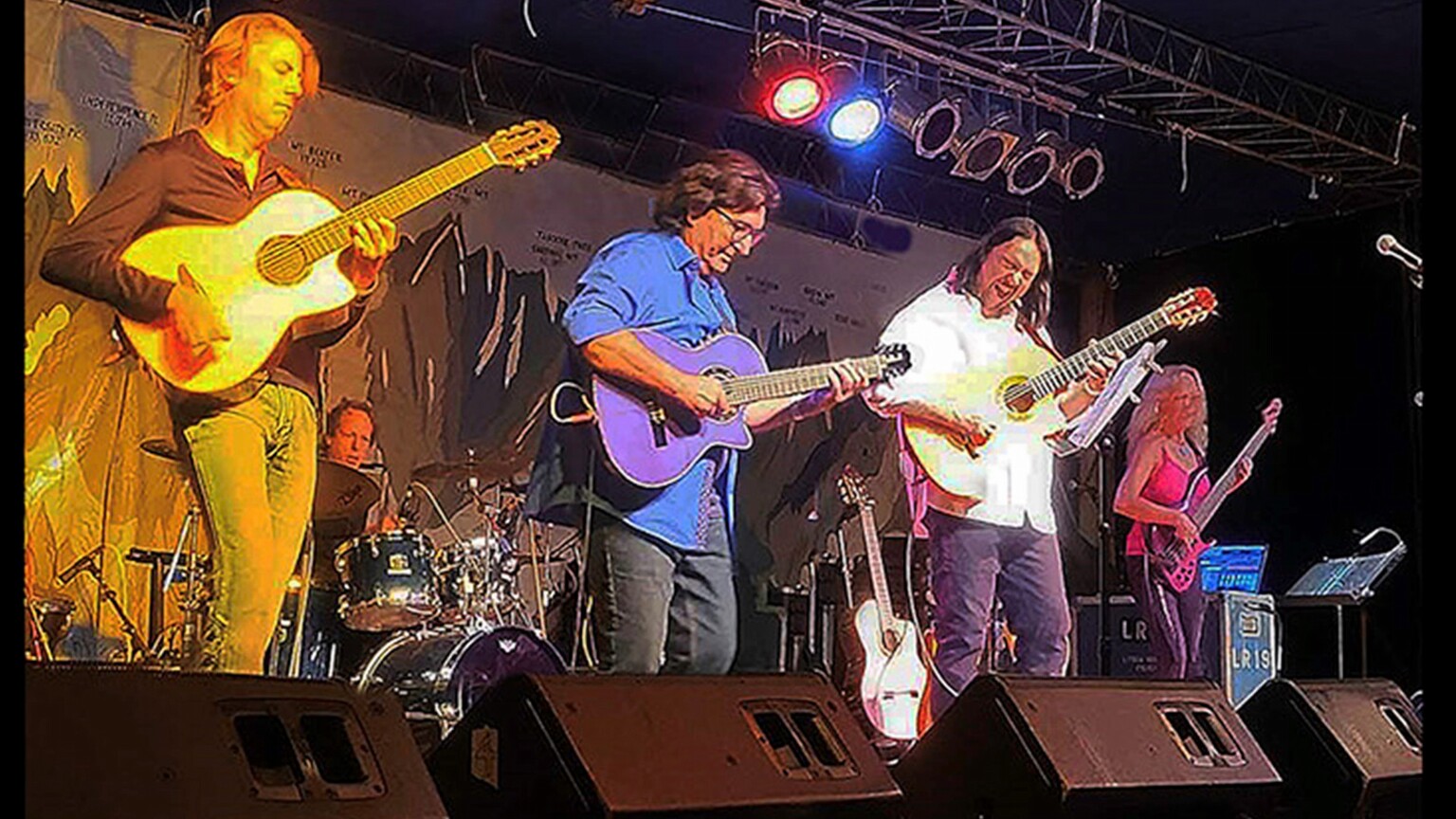 A band playing live on a stage.