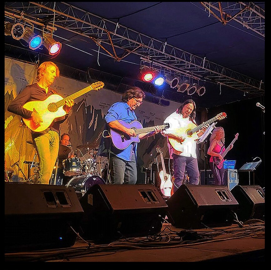 A band playing live on a stage.