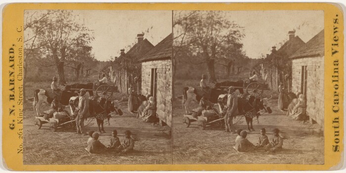 The image shows a rural scene with individuals gathered near simple buildings with thatched roofs. A group of people, both adults and children, are around an ox-drawn cart. The horizon is low in the picture, intersected by a row of buildings. In the background, leafless trees stretch toward the sky. The color palette is primarily sepia-toned.