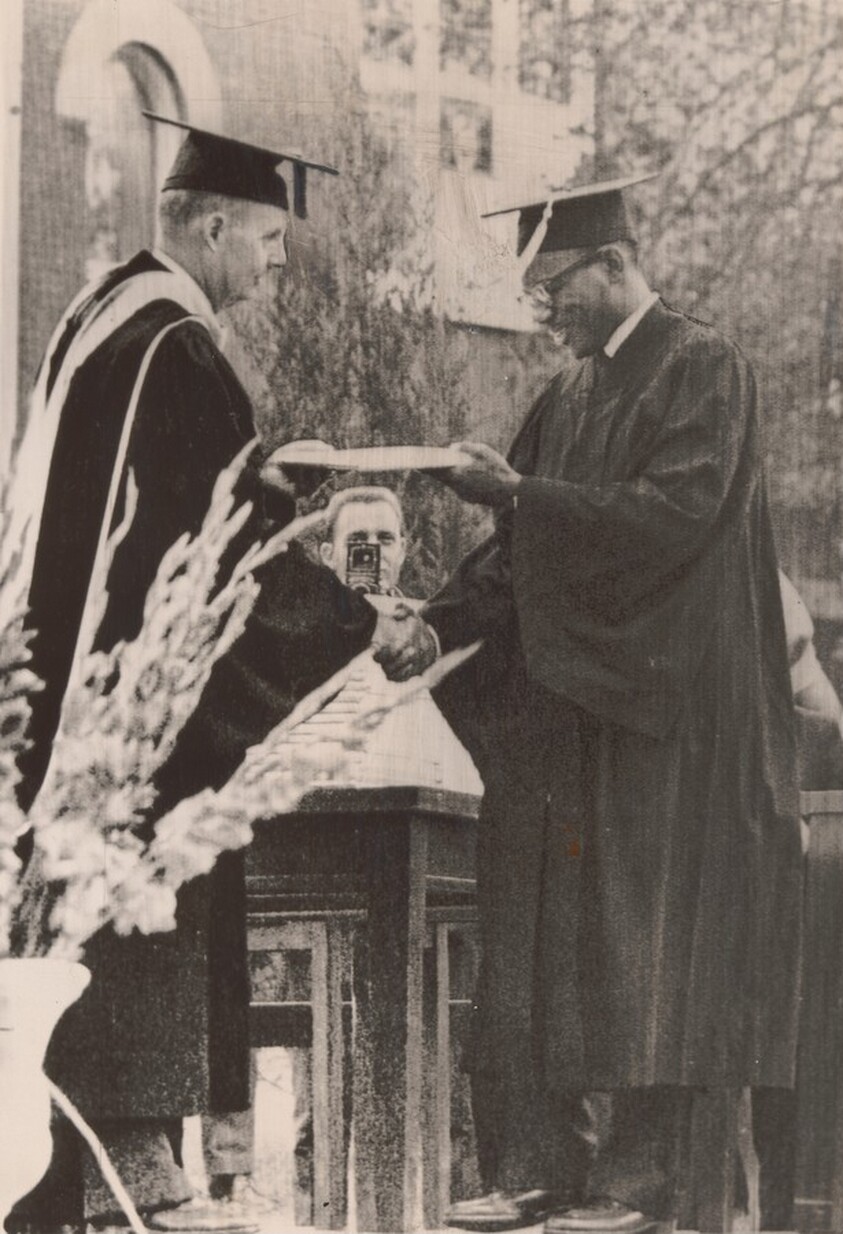 Title from caption on object: “A Grinning James Meredith Accepts His Bachelor of Arts Degree from University of Mississippi...”