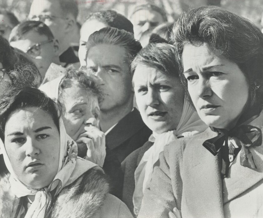 Title from caption on object: “Emotions Show on Faces in the Crowd as President Kennedy's Body Passes By”