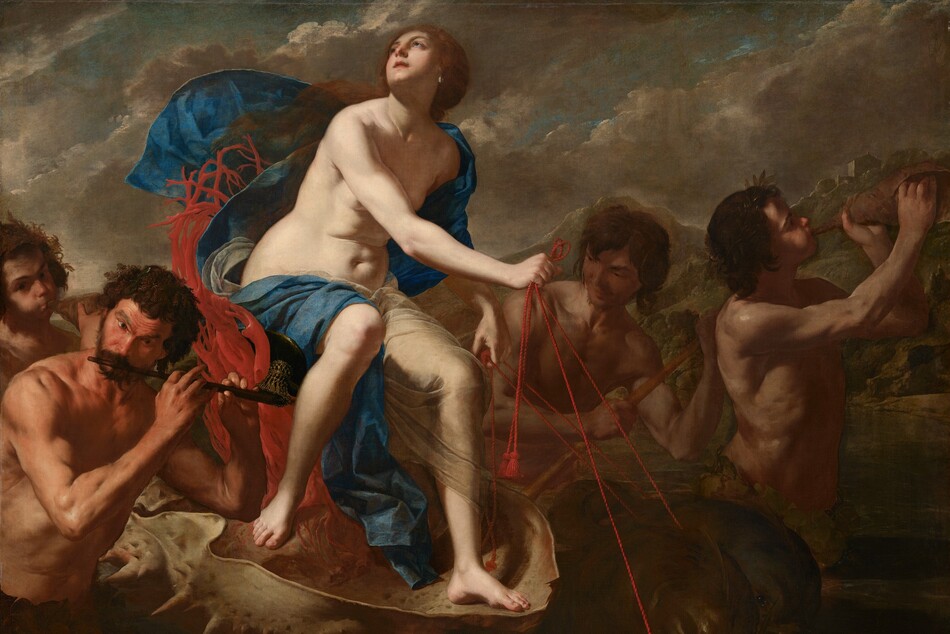A nearly nude, pale-skinned woman rides an oversized seashell being pulled by stylized dolphins in this horizontal painting. Four muscular, tanned men with dark, unruly curly hair surround the shell and play music. The woman sits on a seat made by twisting red coral with her body angled to our right. She turns her face up and to our left, to the sky. She has dark eyes and brows, a heart-shaped face, a cleft in her chin, and her pink lips are parted. Her auburn-brown hair appears gathered at the base of her neck and long tresses lift in the breeze over her right shoulder, to our left. A teardrop-shaped pearl hangs from the ear we can see. A celestial-blue cloth and a translucent white veil wraps over one shoulder and flutters behind her. The cloth then drapes across her back and over her thighs, exposing her soft tummy and rounded hips. The fish-like dolphins pulling the shell have rounded heads and black, glassy eyes. Short fins run the length of their curved backs over dark, olive-green skin. The woman guides them using red, twisted cords looped through their mouths. A pair of musicians are to each side of the shell. To our left and in the lower corner, one man holds a flute to his lips. The outer corners of his eyebrows arch up under a lined forehead. A ring of broad leaves wraps around his waist. Another man behind him blows with cheeks puffed into a shell as he looks at us. In the pair to our right, on the far side of the shell, one man holds a stick, perhaps guiding the vessel, while another, at the front of the grouping, blows into a shell. The man at front wears rings of leaves around his head and waist. The scene is lit starkly from our left, illuminating the woman and casting the rest into shadow. The water around the group is dark, pine green. Rocky mountains dotted with trees and buildings rise in the distance. Ash-gray clouds create diagonal bands moving up and to our right against a muted blue sky.