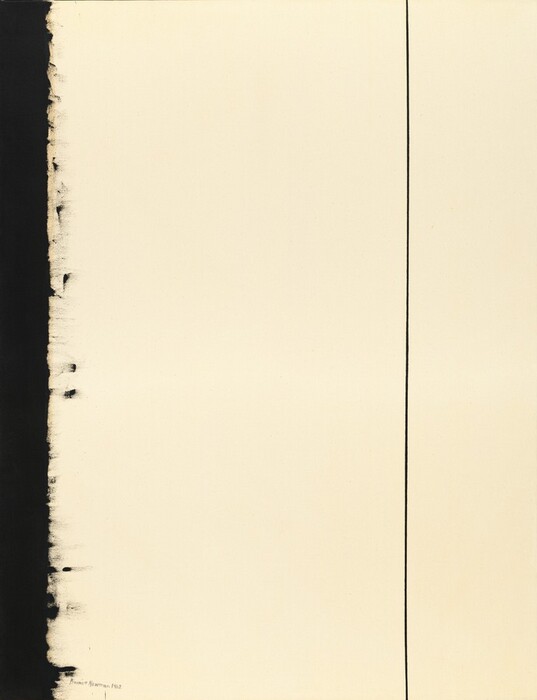 A vertical black band and thin black line span the height of this otherwise cream-white, vertically oriented abstract painting. The black band is along the left side of the canvas, and its inner edge feathers inward. The black line cuts up the canvas about three-quarters of the way across from the left. The artist signed and dated the painting in the lower left corner in black, "Barnett Newman 1962.”