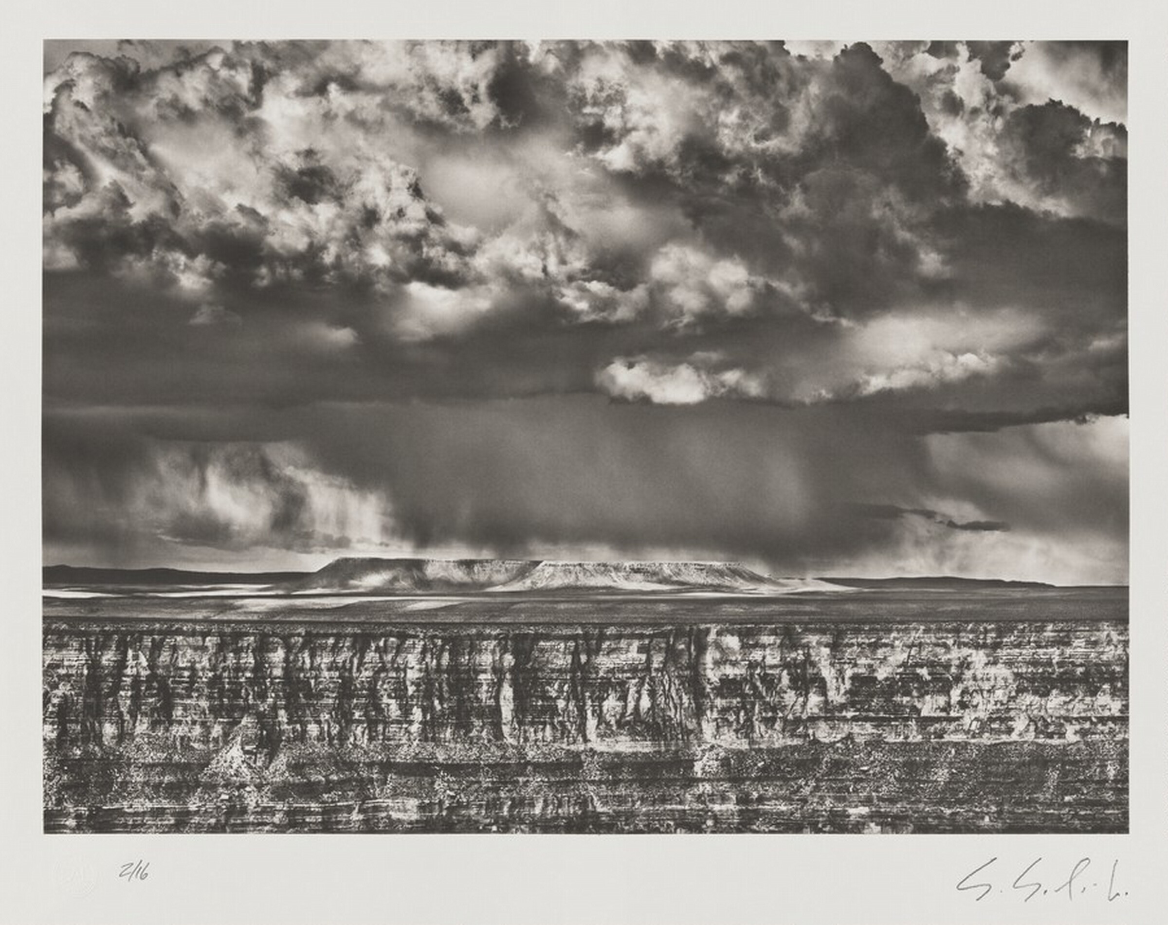 The Grand Canyon viewed from National Forest, Arizona. The big mesa visible on the far side of the canyon is in Navajo territory. This photograph was taken during a localized snowstorm. USA., Sebastião Salgado, 2010