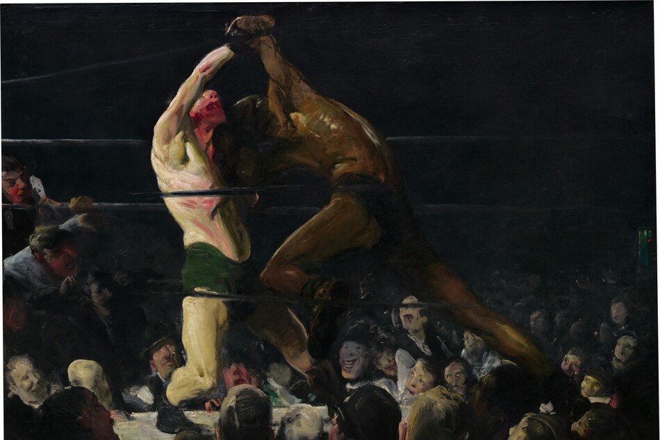 From a darkened arena around a boxing ring, we look up at two bare chested men, one with pale, white skin and the other with brown skin, who lock arms in a boxing match in this horizontal painting. The brushstrokes are loose and visible throughout, making some details difficult to make out. The boxer to our left wears drooping, forest-green trunks and black shoes. He leans back on his bent right leg, closer to us, and tilts his face up. His mouth gapes open and his nose, chin, and neck are smeared with scarlet red, suggesting blood. His pale skin has a green cast, and his chest, arms, and legs are sinewy and muscular. His right arm is raised or pulled up overhead by the boxer to our right. Wearing dark briefs, the second boxer hunches over with head lowered toward the other man’s shoulder. He surges forward onto his deeply bent left knee, closer to us, pushing powerfully off his back leg. His face is lost in shadow and his body has less detail than his opponent, though light glints off his arching back to create gold highlights against his brown skin along his spine, ribs, and muscles of the shoulder. The men’s bodies nearly span the height of the canvas. The black ropes of the boxing ring pass in front of and behind the boxers, and the space around the ring in the top half of the painting is nearly black. Heads and faces of the spectators in the first few rows are lit by the main event and are crowded into the bottom third of the painting. Two spectators on our far left have climbed up and lean on and through the ropes, their mouths open. The crowd, which appears to be all light-skinned men and boys, are painted loosely but their mouths widen in toothy grins or are agape. The artist signed the work in yellow letters against black in the lower right corner: “Geo Bellows.”