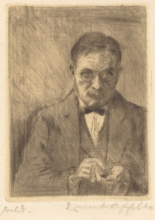The image depicts a man in a formal suit with a bow tie, sitting or standing at a slight angle. He has short, neatly combed hair and a serious expression. His hands are in the foreground, holding a small object. The background is a textured surface.