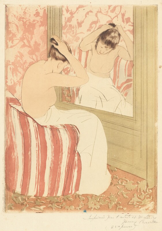 A pale-skinned woman, nude from the waist up, gathers her hair in her raised hands as she sits before a mirror in this vertical, colored print. The large mirror is to our right, and the woman’s body is mostly turned away from us. Her head is bowed but a loose tendril of brown hair hanging beside one cheek is reflected in the mirror. Her lower body is wrapped in a voluminous off-white cloth as she leans forward on a curved terracotta-red and white striped armchair. Her facial features, the contours of her body, and the folds of the towel are all delineated with thin strokes of tawny brown. The mirror is set into a tan wall, and the wall beyond and carpet below her covered with abstract floral patterns. The wall has a dusty-rose motif over lighter pink background while the carpet pattern is tan against muted dark pink background. The wall and chair are reflected in the mirror in paler tones. A mark with an oval, or a mirrored C, over an uppercase M, is stamped in royal blue at the bottom center of the print. The sheet is inscribed with graphite across the right half of the bottom margin, “Imprimée par l’artiste et M. Leroy Mary Cassatt (25 épreuves)."