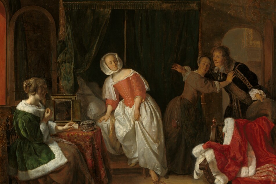 A young, smiling man bursts through the door of a dimly lit bedroom occupied by three women in this vertical painting. All four people have pale skin. The arched door is to our right and the man faces our left with his arms spread wide. He leans slightly forward as he holds the wide brim of his hat out by his left side, to our right. Shoulder-length chestnut-brown hair frames his face, and he wears a velvety brown jacket trimmed with tan stripes and pompoms down the front and along the sleeve we can see. A broad sash crosses his chest and tassels hang from his wide, white collar. Between us and him, a wooden chair is draped with a crimson-red cloak trimmed with white fur and bands of gold. A pewter pitcher and candlestick rest on the pine floor in front of it, near the lower right corner of the painting. The man is stopped at the door by a woman wearing a sable-brown gown with a tight-fitting bodice and a white cap on the back of her head. Her body faces the man as she leans toward him with her outstretched right hand resting on his shoulder, and she turns her smiling face back over her shoulder. Light from an open window on the left illuminates the woman in the center, who steps down from a bed enclosed by forest-green, velvet curtains trimmed with gold fringe and tassels. The curtains are parted behind her to reveal white pillows. She wears a long, gleaming white satin skirt topped by a tight-fitting coral-red bodice stitched with thin lines of gold. A white neckerchief covers her shoulders and is partially tucked into the bodice. Her head is covered by a white kerchief knotted under her chin. Her body faces us with one foot on a step stool, and the other foot reaches down to a gold and red shoe on the floor. Its mate lies nearby, pointing away from us. Her head is turned to our right to look at the man. She has a thin face with a high forehead, and small mouth is closed or pursed. Closest to us and near the lower left corner of the painting, the third woman sits alongside a small table under the open window. She wears a long, pine-green jacket trimmed with white fur over a brown skirt. Her auburn hair is partially coiled around her head, while some locks fall in bunched curls. She sits facing our right in profile with her back to the window, so her smiling face is mostly in shadow. Her left arm rests on the table, which is draped with a red and copper patterned cloth, and she holds a white comb in that hand. A mirror and round silver box sit on the table next to her. A small brown and white dog stands by her feet, its head tilted up to look at the others. The far wall of the room is covered with a faint pattern of golden brown vines and leaves against a forest-green background. The artist signed the painting on the face of the step leading up to the bed, “G. Metsu.”