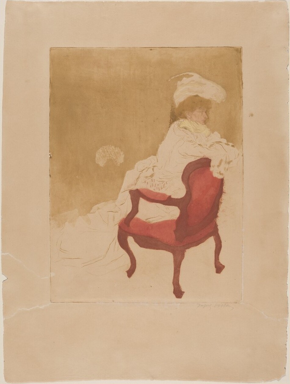The image depicts the upper half of a person sitting on a red upholstered chair with a dark wood frame. The person is reclined slightly to the left side, with their arms resting on the backrest of the chair. They have auburn hair partially visible under a large-brimmed white hat with a feather. The person's face is in profile with distinct features and a subtle expression. They wear a layered garment with ruffled textures, potentially a light-colored dress, and a light yellow fabric around the neck area. No jewelry or objects are visible in their hands. The background is a soft, textured brown wash.