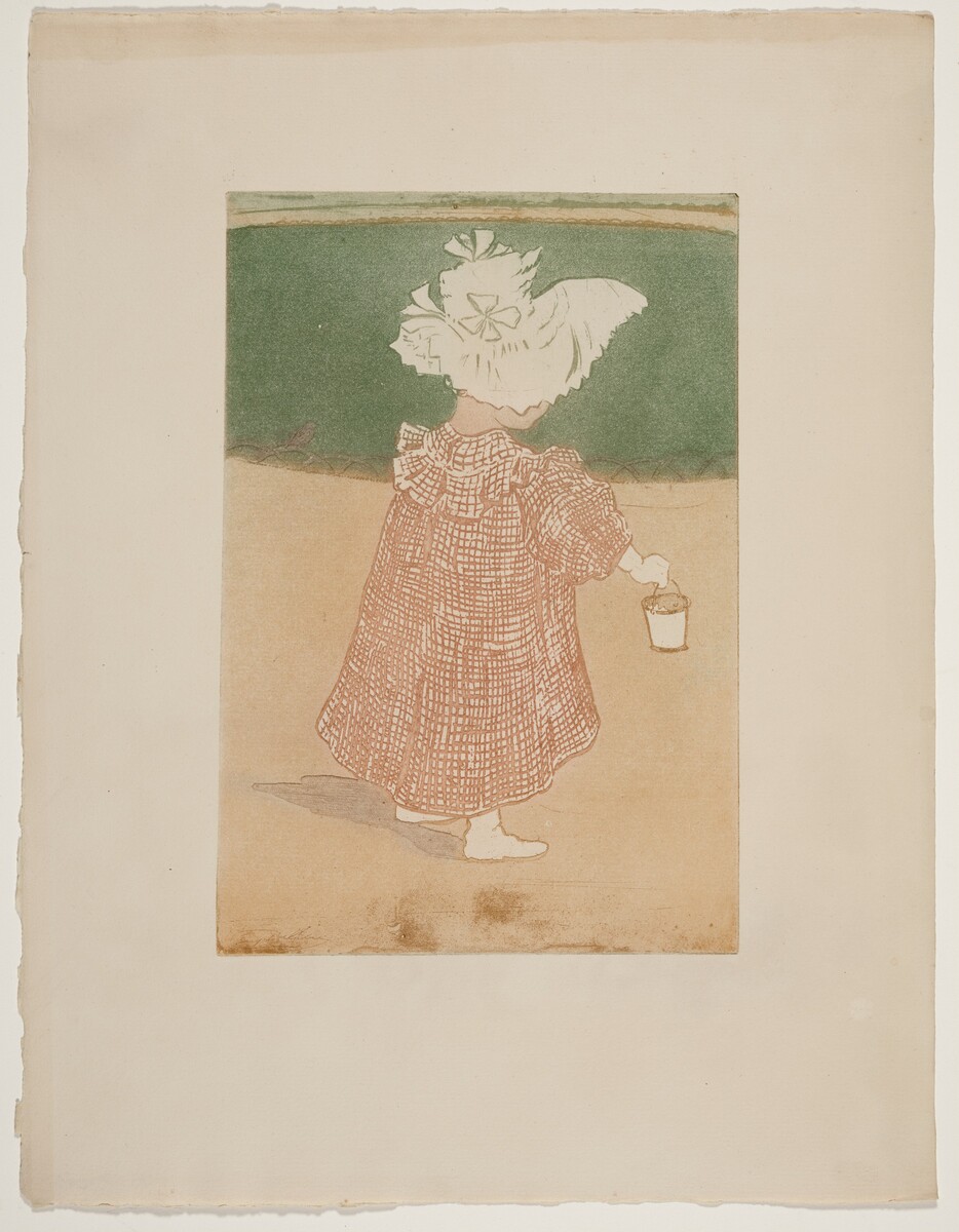 The image shows a young child facing away from the viewer. The child is walking with their left foot slightly forward and is wearing a long checkered dress and a wide-brimmed bonnet. They are holding a small bucket in their right hand. The background depicts a shoreline with sand meeting greenish water or grass.