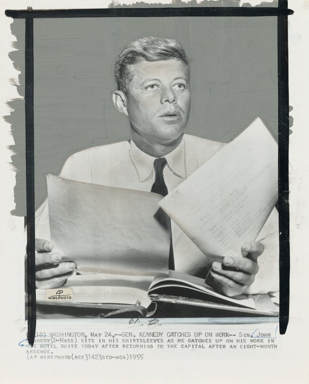 Title from caption on object: “Senator Kennedy Catches Up on Work”
