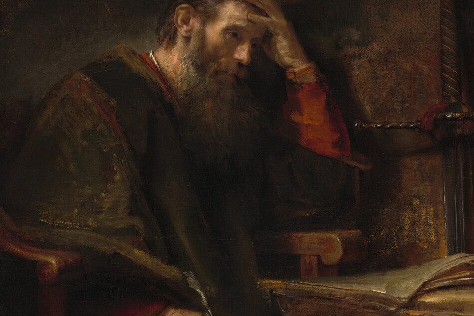 Shown from about the knees up, an older, bearded, pale-skinned man sits at a desk with his head in one hand in a shadowy room in this vertical painting. His body is angled to our right, and he sits in a heavy wooden armchair next to a desk. His left elbow, farther from us, rests on the chair’s arm, and he holds that hand to his forehead. He holds a quill with his other hand, which brushes his knee. He has ash-brown hair covered at the back by a cap and a long shaggy beard. He looks off to our right with dark, shaded eyes. His voluminous brown robe is brushed loosely with golden brown highlights. The rust-red garment under the robe is visible at the sleeves, neckline, and one knee. The desk, to our right, has a stack of papers or parchment. The oversized hilt of a long sword leans against the wall behind the desk. The background is painted with areas of earth and chestnut brown. Some areas of the scene are loosely painted so brushstrokes are visible, especially the brightest white highlights on his collar, the quill, the edges of the parchment, and glints on the sword. The artist signed the painting on the face of the desktop, near the lower right corner: “Rembrandt f.”