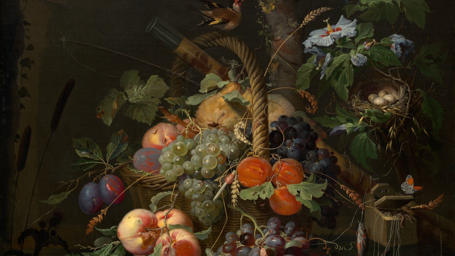 Fruit, flowers, birds, small animals, insects, and fish are piled in and set around a woven basket in woodland setting in this vertical still life painting. The color palette is dominated by rich colors of emerald and pine green, plum purple, butter yellow, and pumpkin orange, with touches of silver and robin’s egg blue. The scene is lit strongly from our left, and the background is swallowed in shadow. The wicker basket with its tall, arched handle has been set before a rough-hewn, stone archway. Birds perch in the tree branches above the basket and on the handle. The fruit in the basket includes green, red, and purple grapes, peaches, plums, oranges, and yellow pears. Tendrils of wheat wind through the fruit and leaves, and around the handle. Green, striped gourds sit to our left next to a cantaloupe at the foot of the basket. Green frogs, a living and a dead lizard, a caterpillar, snail, and insects sit, lie, or move on the dirt ground around the gourds and melon. To our right, about a third of the way up the composition, worms spill out of a wooden box from which hang several fishing lines holding silvery fish. A small, ivory-white butterfly with black markings and a patch of vivid orange on each wing sits on the lid of the box. Above the box of bait, a nest with four cream-white eggs is tucked among the branches of a hibiscus plant with pale blue, flaring blossoms. A mossy, narrow oak tree trunk bearing acorns rises behind the basket, in front of the stone arch, and off the top edge of the painting. A fishing rod and a cylindrical wooden case painted golden yellow with rust-red designs are propped at the back of the basket. Dark silhouettes of cattails, rocks, and frogs are shown around a pool of water in the lower left corner.
