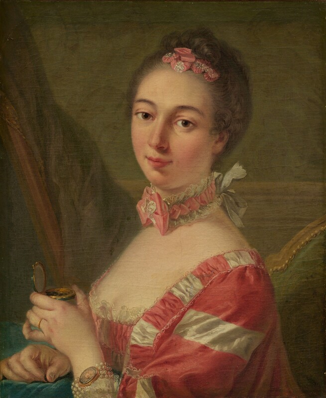 Shown from the chest up, a woman with smooth, pale, peachy-toned skin wearing a carnation-pink and white gown looks at us from this vertical portrait painting. The woman’s shoulders are angled to our left, but she turns her head and tips it to our right to look at us with brown eyes under curving, gray brows. She has an oval face with a straight nose, a hint of a double chin, and her full pink lips are closed in a slight smile. Her ash-brown hair is pulled up and back and curls across the top of her head around pink and white ribbons pleated to resemble flowers. Her square-necked, low-cut bodice is lined with lace across her pale decolletage. The fabric is patterned with thinner white stripes and wider dark pink stripes. A choker tight around her neck has a pink ribbon edged with white lace and tied into a bow at the front of her throat. The necklace is tied on with a white bow at the back of her neck. She wears a gold ring on the fourth finger of her left hand, which is closer to us. On that wrist, four strands of white pearls hold a miniature oval portrait of a pale-skinned person. The woman holds a gold and emerald-green compact with that hand, and the other rests on an aquamarine-blue cushion or cloth in front of her at chest height. She pinches something brown between those fingers, and a few specks of brown are in the box. She sits in a wooden chair upholstered with moss green on the back. A curtain or other swath of muted purple fabric is to the left, and the wall behind her has chair-rail molding and is painted soft leaf green.