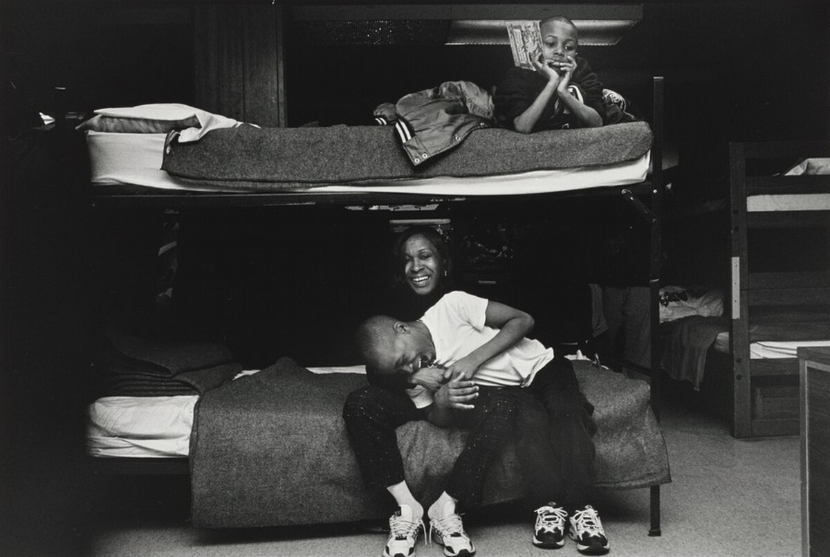 Sunday morning, Margie demonstrates the love and affection she has for her son, Pierre. Olive Branch Mission, Chicago.
