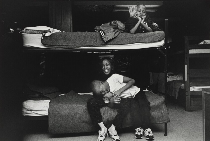 Sunday morning, Margie demonstrates the love and affection she has for her son, Pierre. Olive Branch Mission, Chicago.