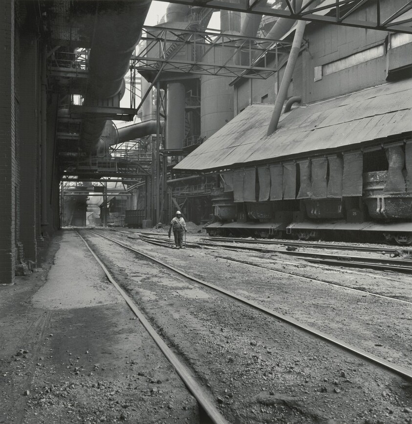 Man Inspecting Railroad Tracks beneath Blast Furnaces, Inland Steel Company, East Chicago, Indiana