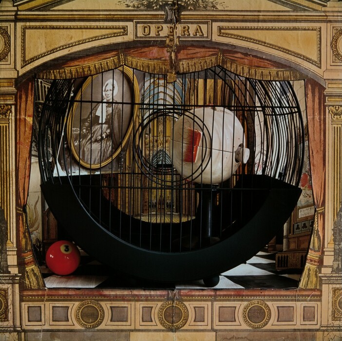 The image displays curved black metal lines forming an intricate lattice design resembling a cage or enclosure. Within it is a spherical object resembling an eye, with a detailed iris and pupil. The background showcases vintage-styled illustrations of an ornate opera house with various architectural elements, including columns and arches, and a framed portrait. A red ball with the number '3' is visible at the bottom left corner.
