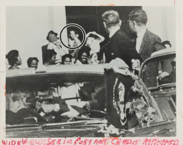 Title from caption on object: “Controversial Photograph Taken before the Doorway of Texas Book Depository at Time of the Assassination...”