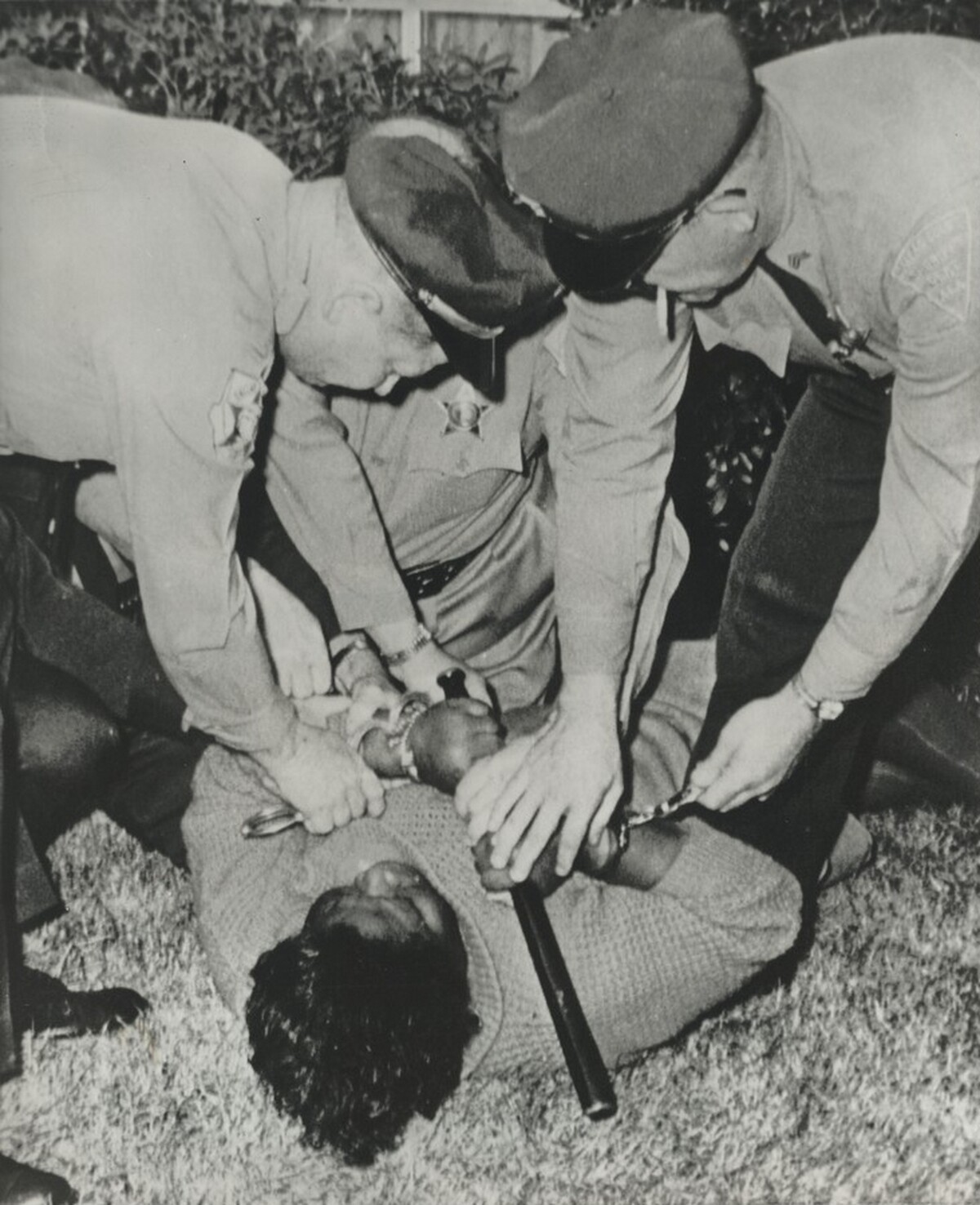 Title from caption on object: “Woman Struggles with Officers”