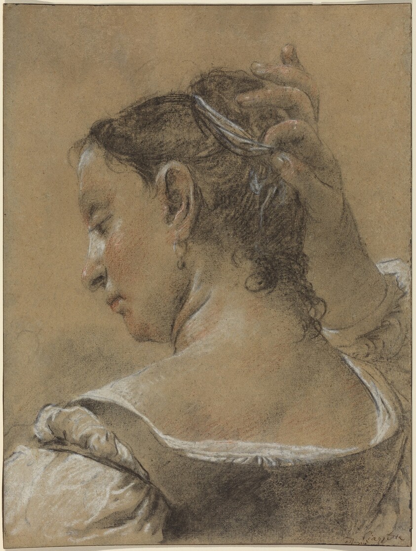A Young Woman Fixing Her Hair