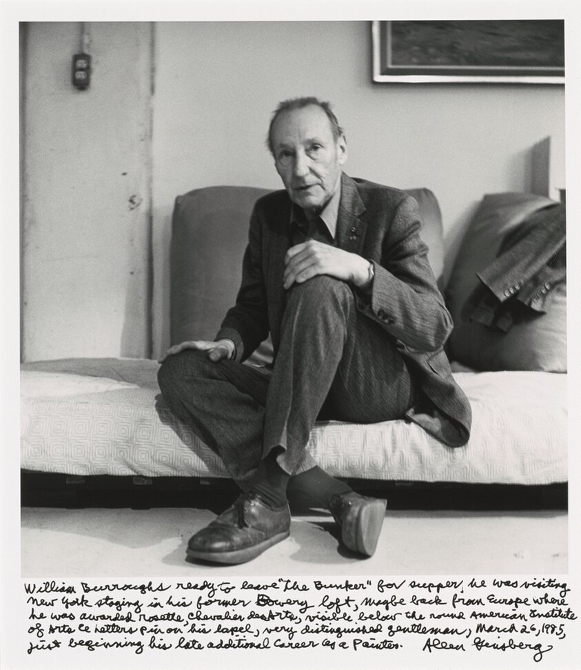 William Burroughs ready to leave "the Bunker" for supper, he was visiting New York staying in his former Bowery loft, maybe back from Europe where he was awarded rosette Chevalier des Arts, visible below the round American Institute of Arts & Letters pin on his lapel, very distinguished gentleman, March 26, 1985, just beginning his late additional career as a painter.
