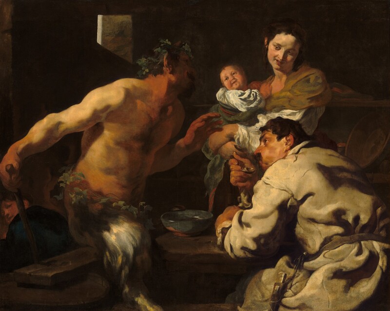 Shown from the about the thighs up, a man, a woman holding a swaddled baby, and a satyr, which has a man’s torso and goat’s legs, sit and stand around a table in a deeply shadowed room, filling this horizontal painting. All the people have light skin and dark hair, and are lit dramatically from our left. To our left, the bare-chested satyr faces our right in profile as he leans toward the table, looking up at the woman. He wears a crown of leaves and has a dark goatee. Almost lost in shadow, a sable-brown horn juts up from his temple. Light falls across his bare shoulders, and his hands and neck are ruddy. Another ring of leaves encircles his waist over the silvery-gray fur of his goat’s legs. He holds his left hand, farther from us, in front of his chest with his open palm facing the couple to our right. His other hand rests at the top of a wooden staff behind his right hip, closer to us. The staff disappears behind a wood plank resting across at least one barrel, which presumably acts as the bench on which he sits on or hovers slightly over. The second man sits at the table to our right, his back mostly to us as he looks over his left shoulder, up toward the satyr, with his face in profile. One brow is cocked over the dark eye we can see, and he has a prominent nose and a mustache. He wears a loose-fitting, long-sleeved, white garment tied around the waist. He blows across a soup spoon held to his lips, his cheeks puffed. He leans on his other arm, which rests on the tabletop near a blue bowl. Across the table, behind the seated man, a woman looks back at the satyr from the corners of her eyes, her coral-red lips curled up in a smile. Her body faces our left and she tilts her head to her left, our right, as she turns her face down toward that shoulder. Her dark brown hair is pulled up and back, and she wears an olive-green wrap over a white shirt. The baby she holds leans away from her chest to twist and look back at the satyr as well. A few details eventually emerge from the deeply shadowed background, including a fourth person tucked into the lower left corner, who looks back over a shoulder at us or the group. Light rims the corner of a window cut from a stone wall, and a few ceramic dishes and cups line two shelves to our right behind the woman.