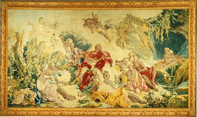 This is a tapestry of people in flowing garments in a pastoral landscape. At the center of the tapestry, a man in a red garment reclines, his eyes closed. He holds a plumed golden helmet on his knee and wears golden sandals. Around him, a crowd of people sitting or lounging on the ground turn to look at him, some pointing. All of the people have light skin and pale-yellow hair. The scene includes musical instruments, white sculptures, vessels spilling water, and many pink flowers among green leaves. Some sections of the tapestry, especially around the center, are bright white. The scene is surrounded by a golden border.