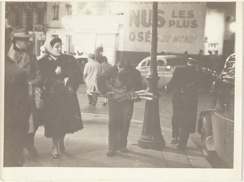 Man with baguettes in street, Paris