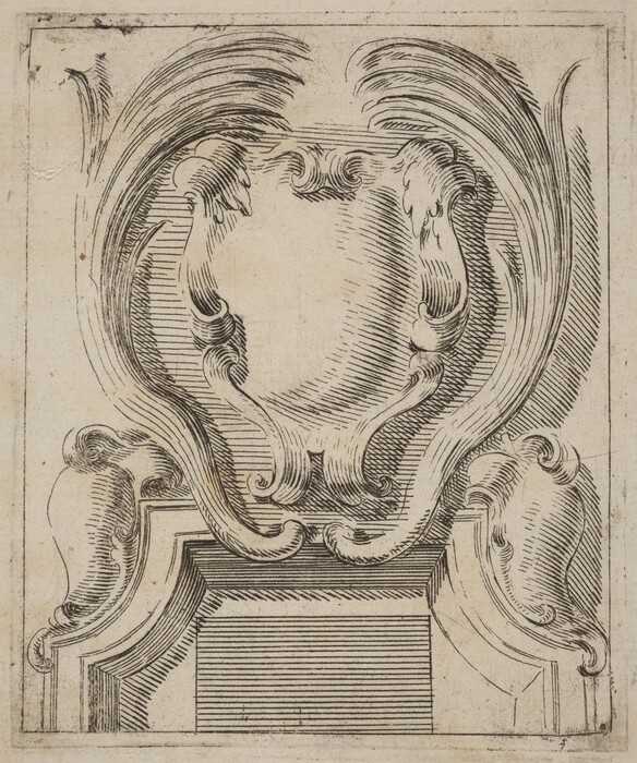 This is a drawing of an ornate architectural design. The image features a detailed illustration of a decorative, baroque-style cartouche with an empty central oval space, surrounded by elaborate swirling acanthus leaves and scrollwork. The lines are intricately drawn, highlighting the elegant curves and intricate detail of the ornamentation. The lower part of the image shows a rectangular panel with parallel lines, suggesting a base or an architectural frieze. The composition showcases the complexity and intricacy typical of classical decorative art.