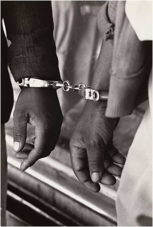 Handcuffed blacks were arrested for being in white area illegally