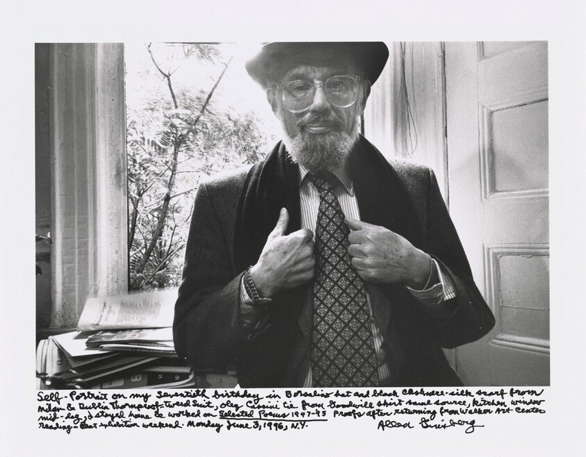 Self-Portrait on my seventieth birthday in Borsalino hat and black cashmere-silk scarf from Milan & Dublin Thornproof-tweed suit, Oleg Cassini tie from Goodwill shirt same source, kitchen window mid-day, I stayed home & worked on _Selected Poems 1947 – ’95_ proofs after returning from Walker Art Centre reading — Beat exhibition weekend. Monday, June 3, 1996, N.Y.