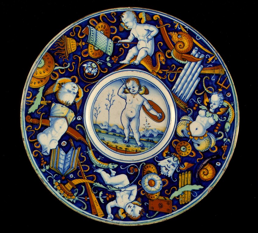 Plate with border of putti and trophies amid grotesques; in the center, a winged putto standing, armed, in a landscape