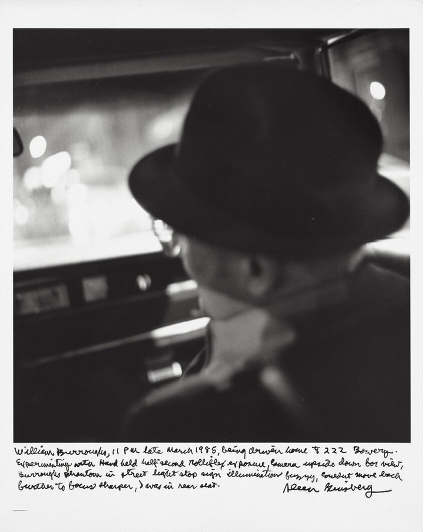 William Burroughs, 11 PM late March 1985, being driven home to 222 Bowery. Experimenting with hand held half-second Rolleiflex exposure, camera upside down for view, Burroughs phantom in street light stop sign illumination fuzzy, couldn’t move back further to focus sharper, I was in rear seat.