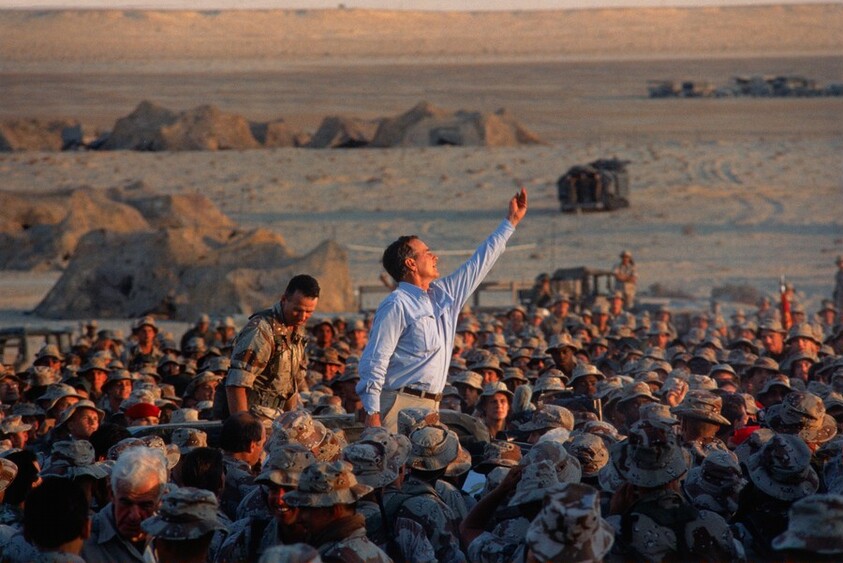 President Bush Tossing Souvenirs to the American Troops of Operation Desert Shield in Saudi Arabia on Thanksgiving Day