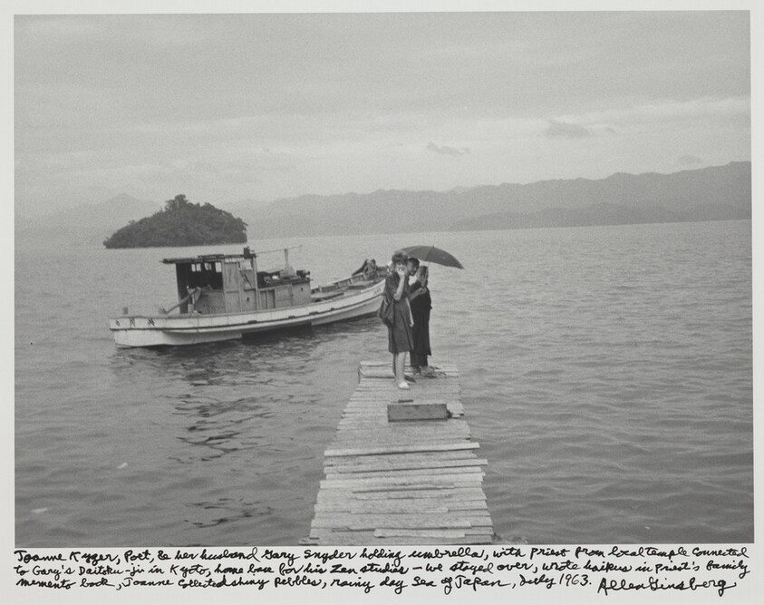 Joanne Kyger, poet, & her husband Gary Snyder holding umbrella, with priest from local temple connected with Gary's Daitoku-ji in Kyoto, home base for his Zen studies - we stayed over, wrote haikus in priest's family memento book, Joanne collected shiny pebbles, rainy day Sea of Japan, July 1963.