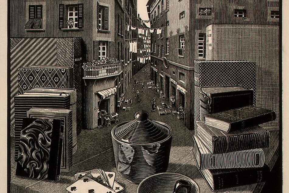 We look across the corner of a wooden table piled with books, playing cards, a pipe, matches, and a covered vessel out into an alley between two tall buildings in this square woodcut print. The scene is printed with black ink on cream-white paper. The corner of the table juts toward us, and we realize that the surface of the table seamlessly becomes the floor of the alleyway beyond. Closest to us, on the table, a pipe and two matches rest in a shallow bowl. A five of spades is face up on the pile of cards to our left, and the pipe, bowl, and cards are reflected in a vessel behind them. The vessel has ribbing or ridges around the sides and along the conical cover, radiating out from a ball-shaped handle. A box of matches sits next to the bowl, to our right. Four books are stacked in a pile to our right, against three taller standing books. Six more books, standing with their spine facing inward, are to our left. The farthest books on both sides rest against the side of the buildings that line the alley, as if the buildings were bookends. The buildings each have three or four stories lined with rectangular windows, some with shutters. There are a few retracted awnings, and lines of white laundry are strung between the buildings in the distance. The roofline of the building to our left nearly reaches the top edge of the paper, and the roof of the building to our right is cut off by that edge. People, tables, and goods, tiny in scale, line the shop openings along the bottom floors of the buildings. The numbers “3-‘37” appear in white against black in the lower left corner of the printed image, and the blocky letters “MCE” appear to the lower right. Pencil inscriptions in the margin beneath each corner of the printed image cannot be made out.