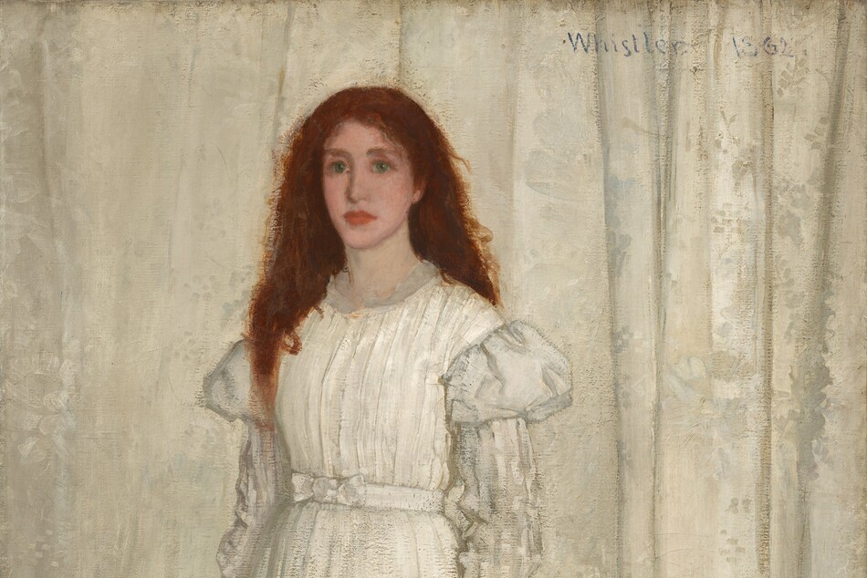 A young woman with pale, peachy skin, wearing a long, flowing white dress, stands in front of a white curtain in this vertical portrait painting. Her auburn-red hair cascades down over and behind her shoulders. She looks to our left with green eyes, and her pink, full lips are closed. Her dress has puffed shoulders above a white-on-white striped pattern on the long sleeves. She stands on an animal pelt; it is not clear whether it is a wolf or a bear. The pelt spans the width of the painting and overlaps a blue patterned carpet. The animal’s mouth gapes to show sharp teeth. Its glassy eyes are wide open, and it seems to look at us. The edges of the animal skin are red. The woman holds a white lily by her side in her left hand, while yellow and purple flowers lie scattered on the pelt.
