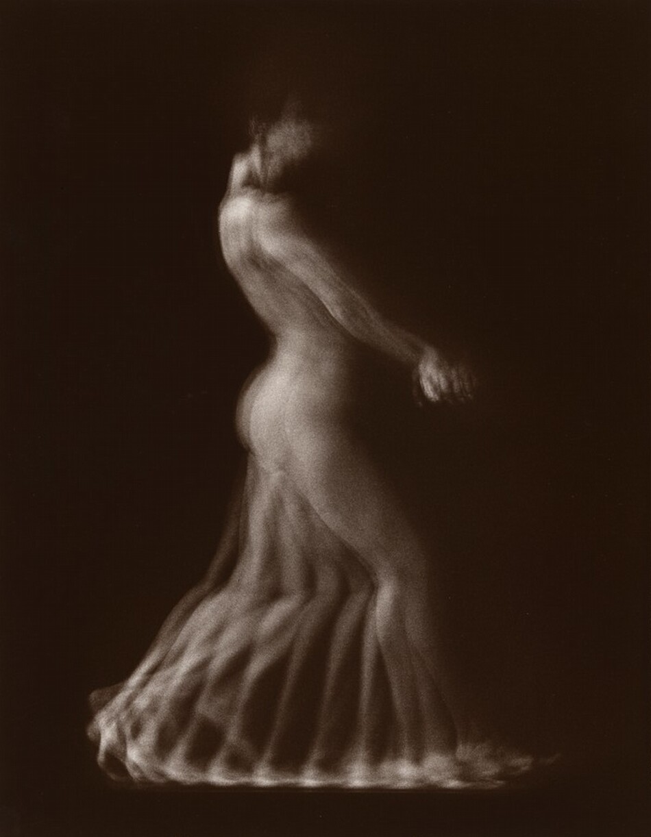 The image depicts a stylized representation of a person's body shown from head to feet in profile. The face and upper body appear blurred and indistinct, suggesting movement. The figure's body merges into a flowing, ethereal form towards the bottom. There are no clothing, jewelry, or distinct objects visible. The background is a solid brown color.