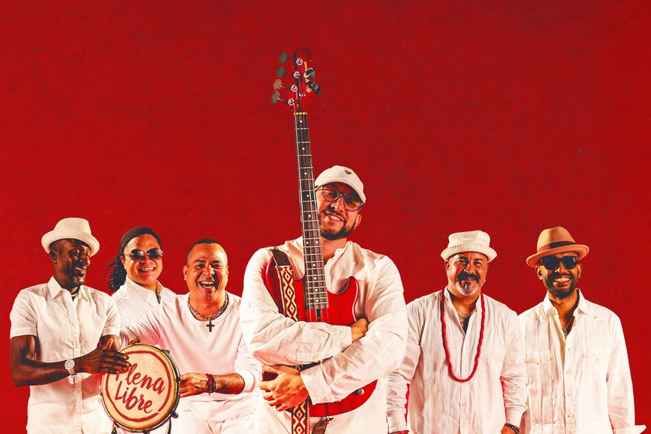 A band posing with their instruments.