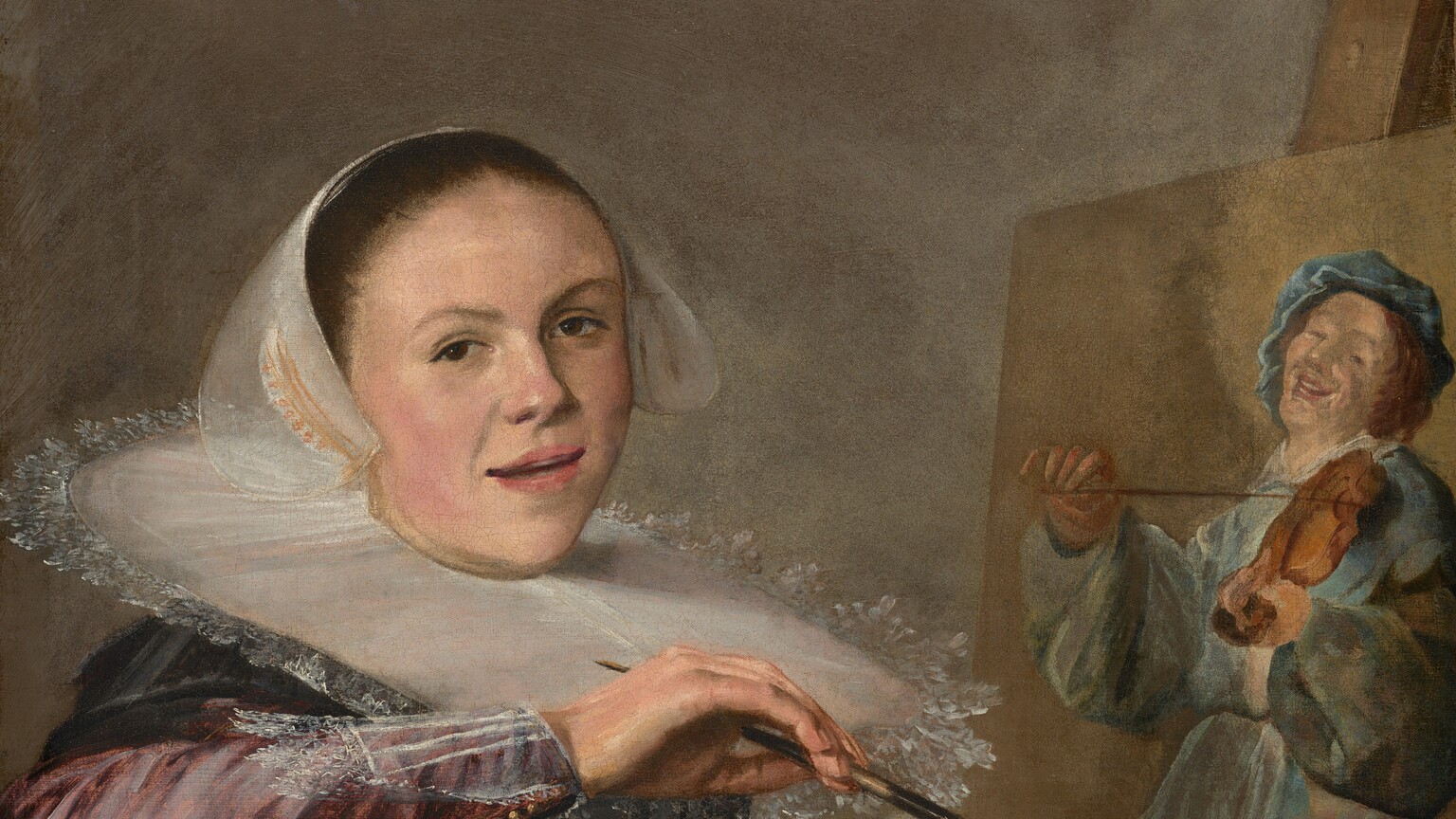 Shown from about the waist up, a woman with smooth, pale skin sits in a chair facing our right in front of a canvas on an easel in this vertical portrait. She leans onto her right elbow, which rests on the seat back. She turns her face to look at us, lips slightly parted. Her dress has a black bodice and a deep rose-pink skirt and sleeves. She wears a translucent white cap over her hair, which has been tightly pulled back. A stiff, white, plate-like ruff encircles her neck and reaches to her shoulders. She holds a paintbrush in her right hand and clutches about twenty brushes, a wooden paint palette, and a rag in her left hand, at the bottom right of the canvas. The painting behind her shows a man wearing robin's egg-blue and playing a violin.
