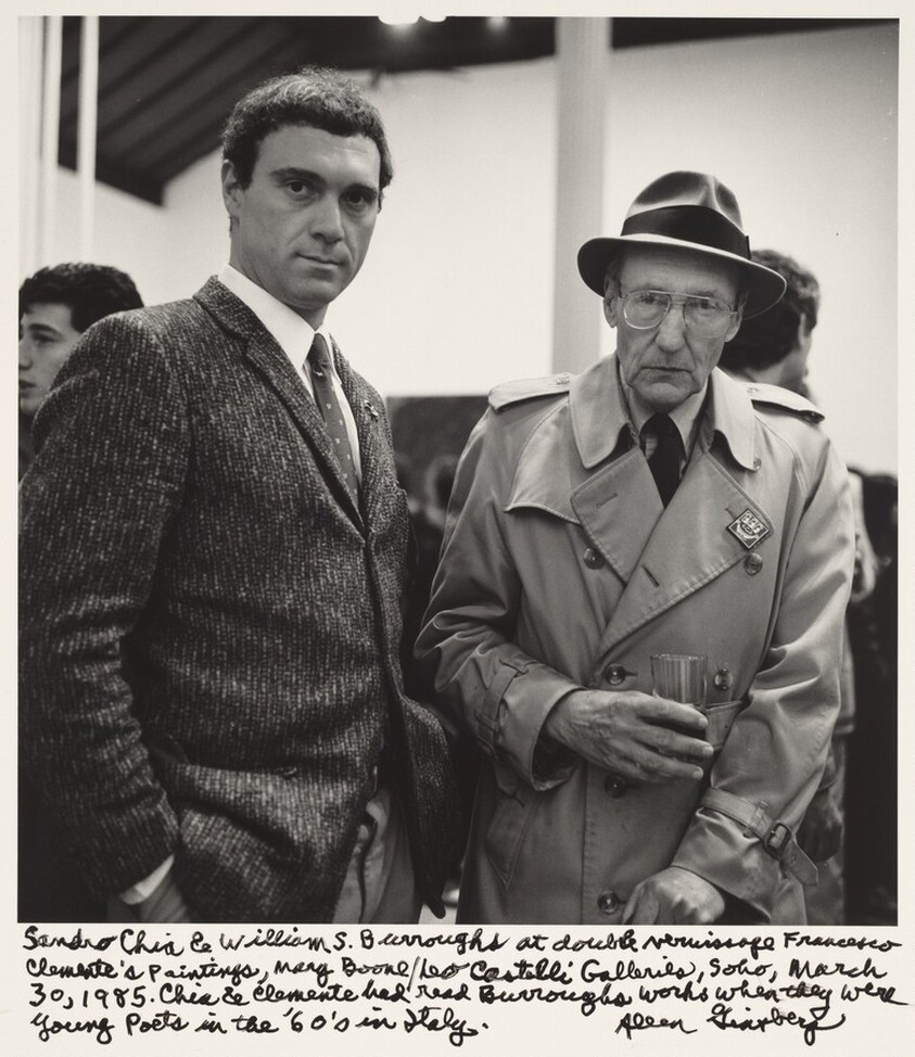 Sandro Chia & William S. Burroughs at double vernissage Francesco Clemente's paintings, Mary Boone/Leo Castelli Galleries, Soho, March 30, 1985. Chia & Clemente had read Burroughs works when they were young poets in the '60's in Italy.
