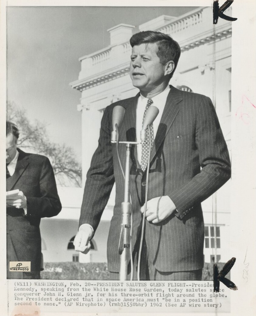 Title from caption on object: “President Salutes Glenn Flight”